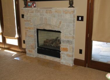 Carpet installation with transition to stone fireplace hearth