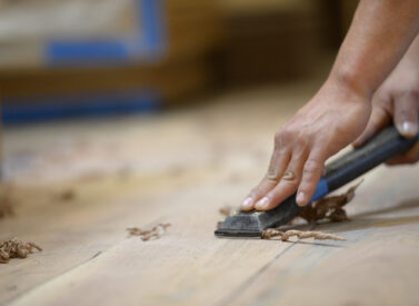 Hand scraping walnut hardwood floor