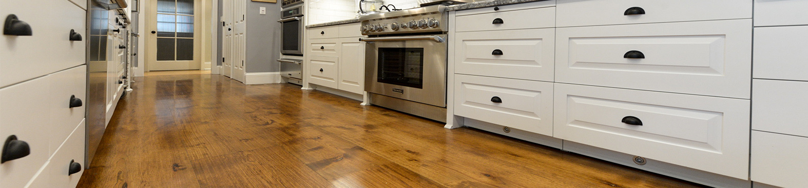 Hand distressed hickory floor in kitchen