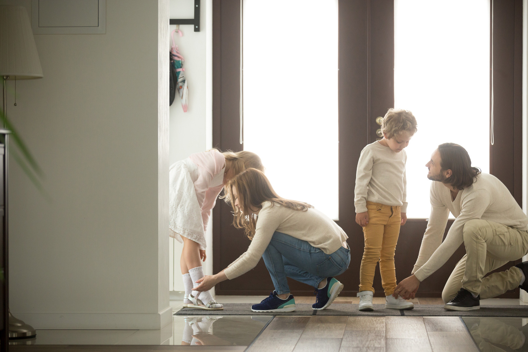 Family getting ready to go out on a Monarch Plank floor